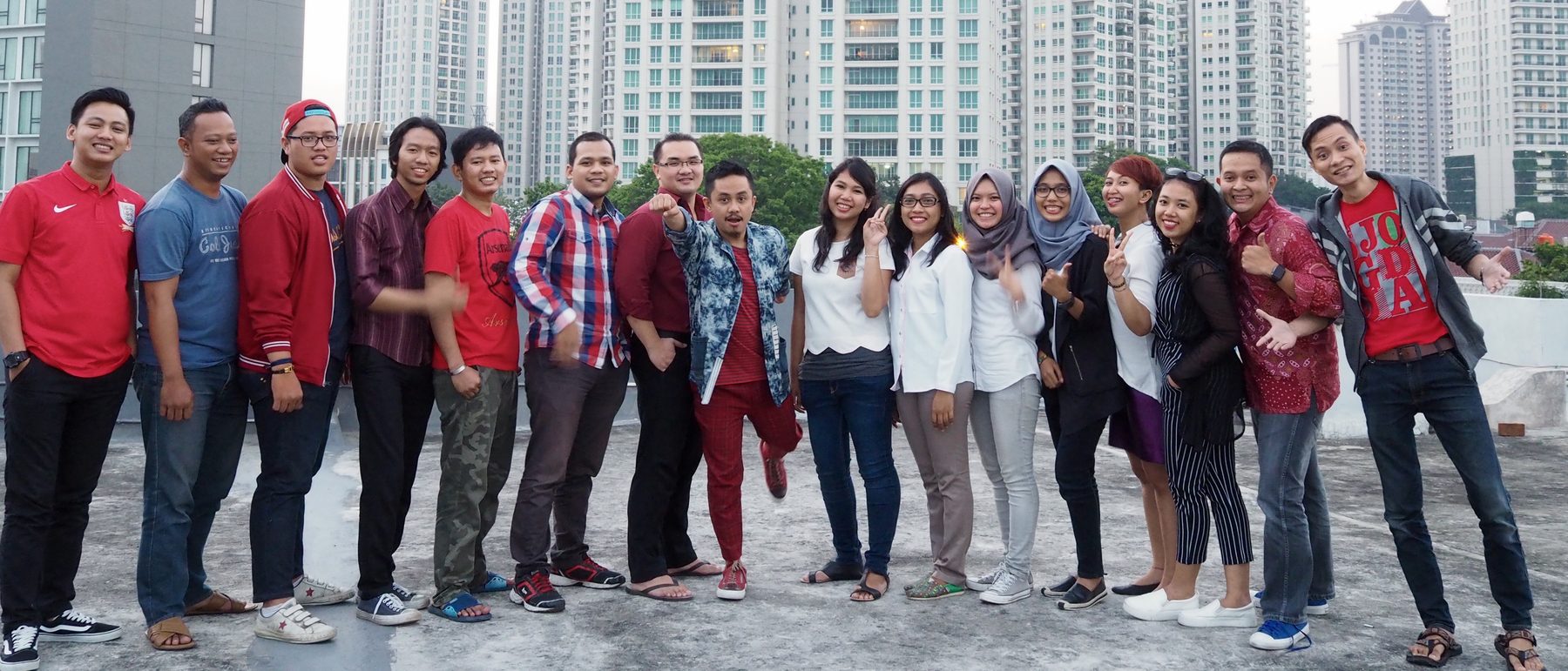 The BIG In Digital team gathered on a rooftop against the Jakarta skyline